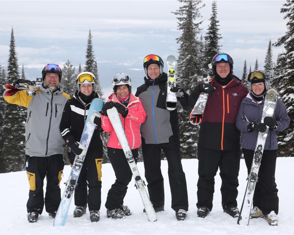group posing with skis